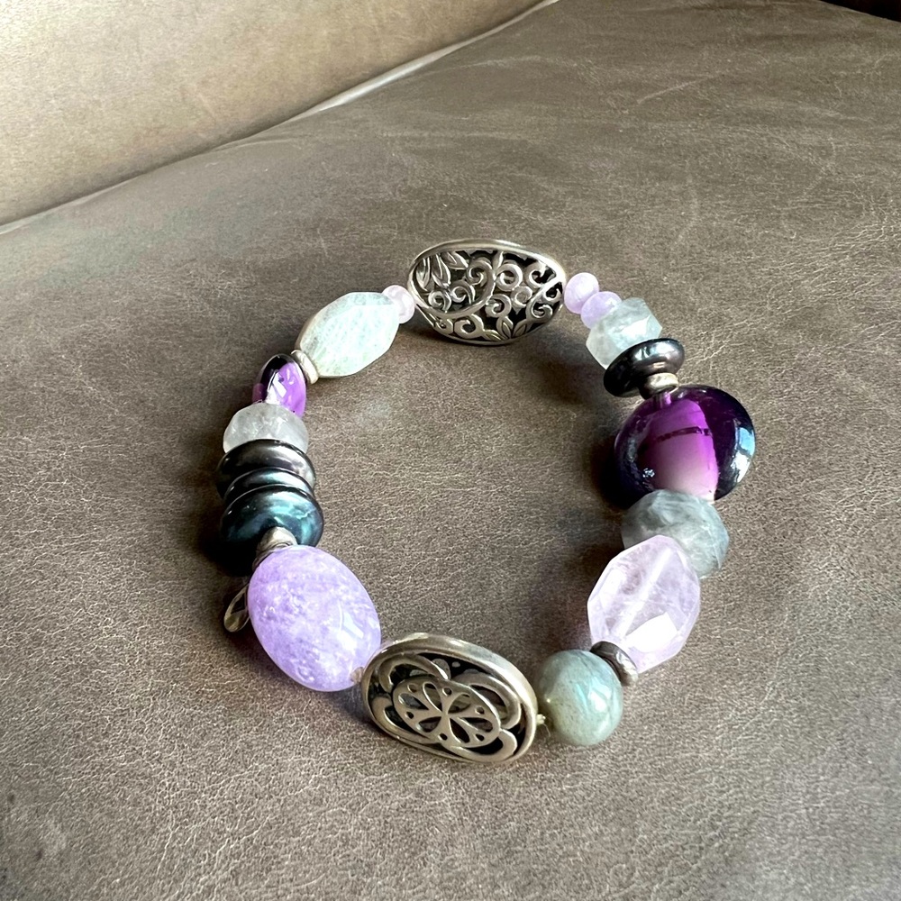 Purple beads with sterling silver details.